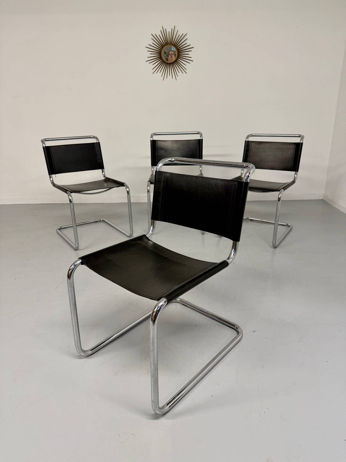 Lot of 4 tubular chairs designed by Mart Stam in vintage black leather from the 1980s.