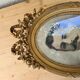 Antique medallion frame in gilded stucco with its period portrait.