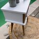 Beautiful vintage bedside table with tapered legs, Scandinavian/pop style in raw white.
