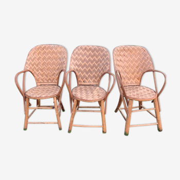 Trio of braided chestnut chairs