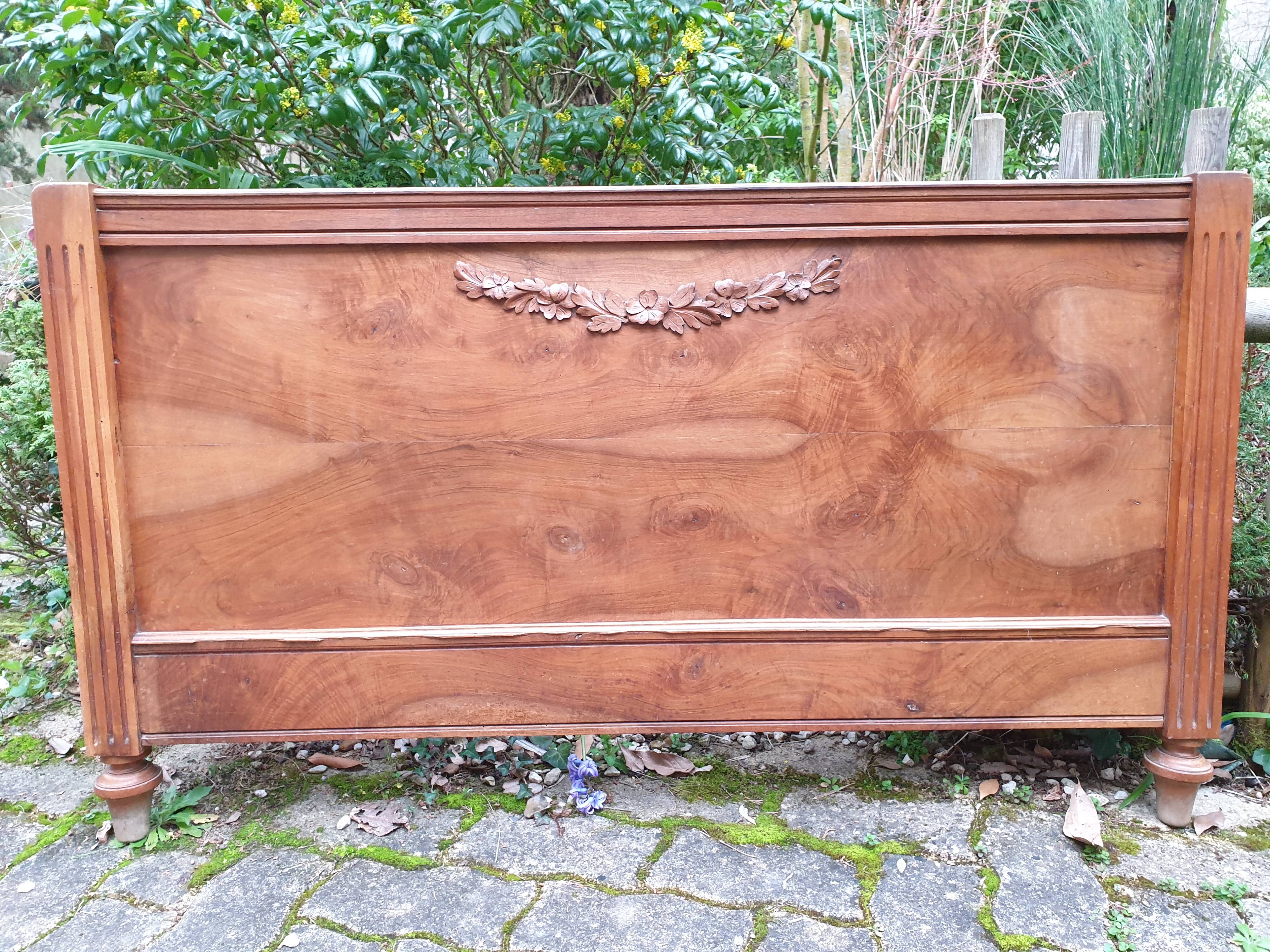 Carved walnut headboard