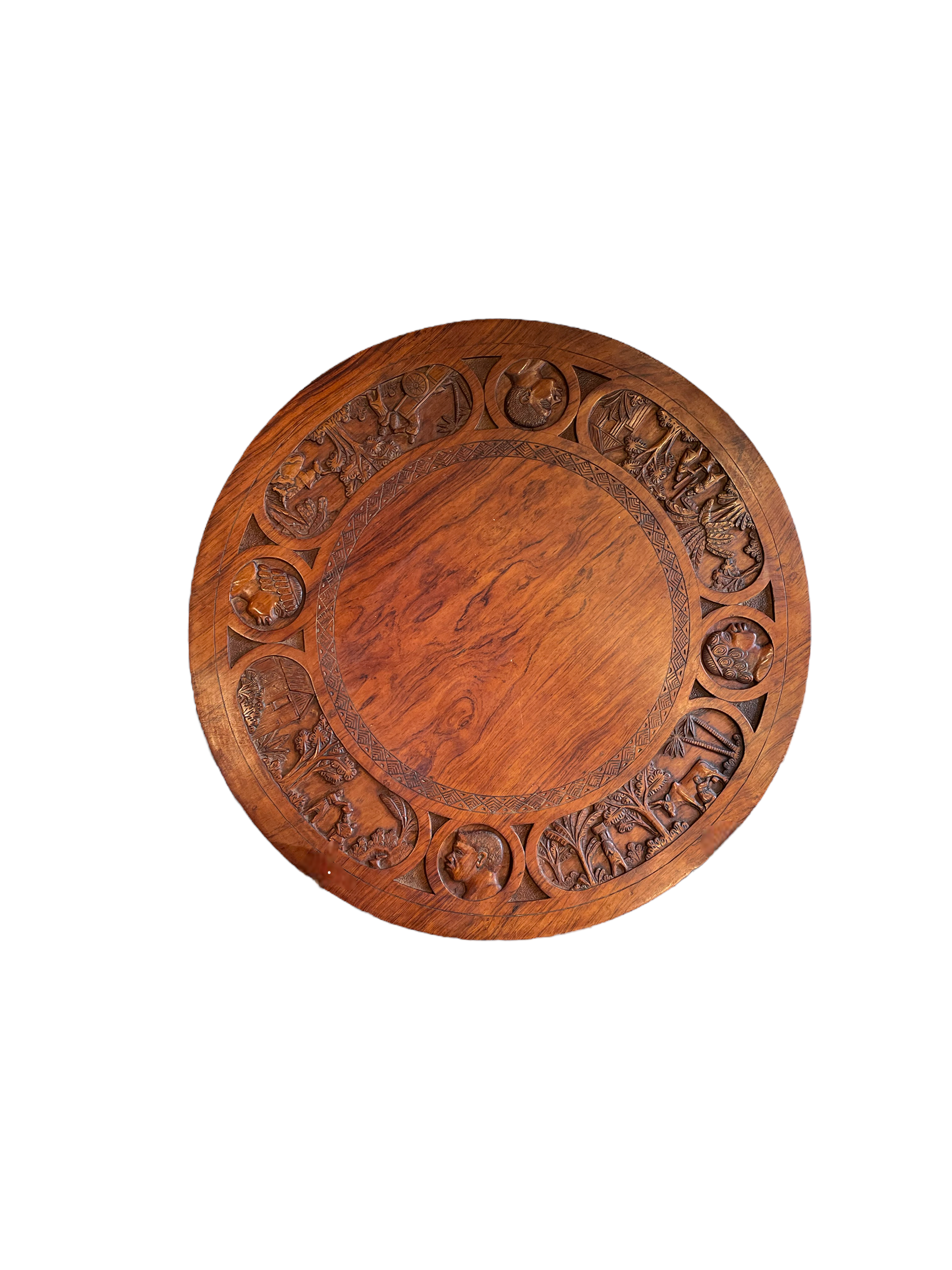 Circular tripod coffee table in carved wood