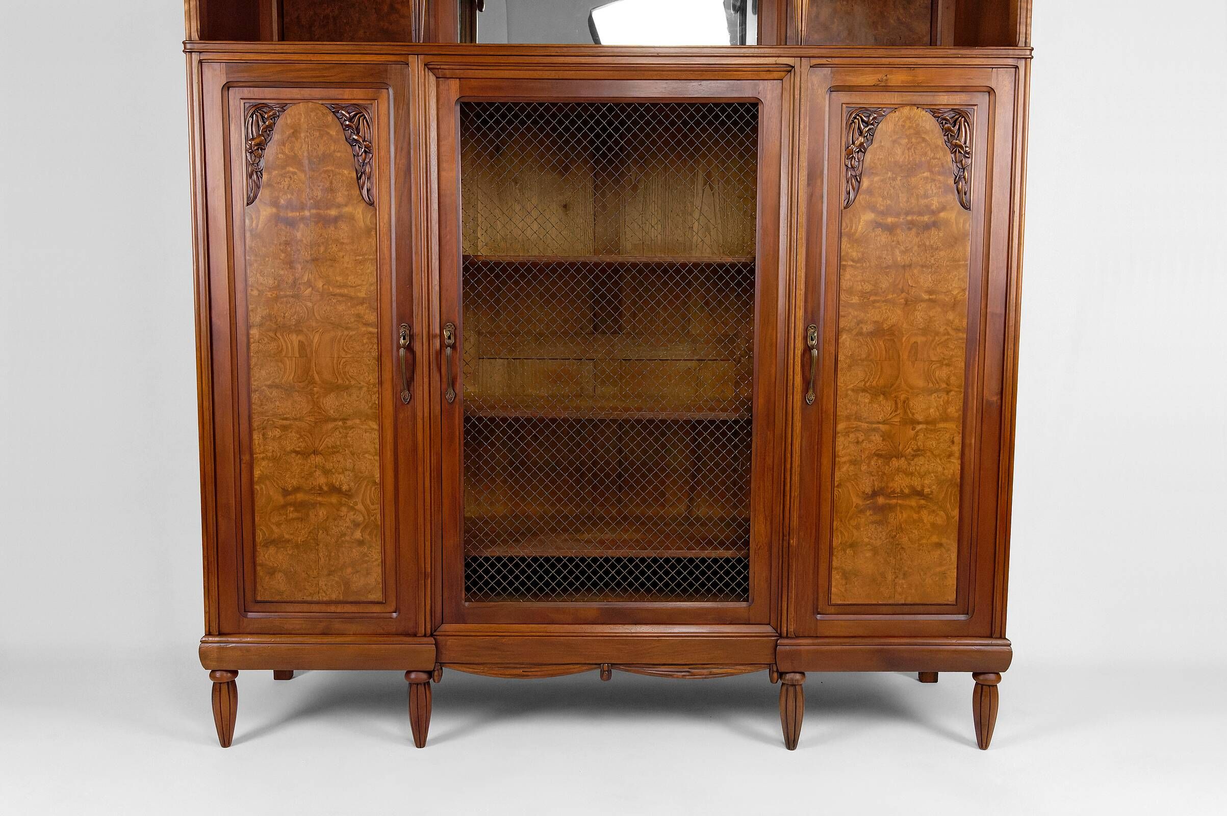 Art Deco showcase bookcase in carved walnut, France, circa 1925