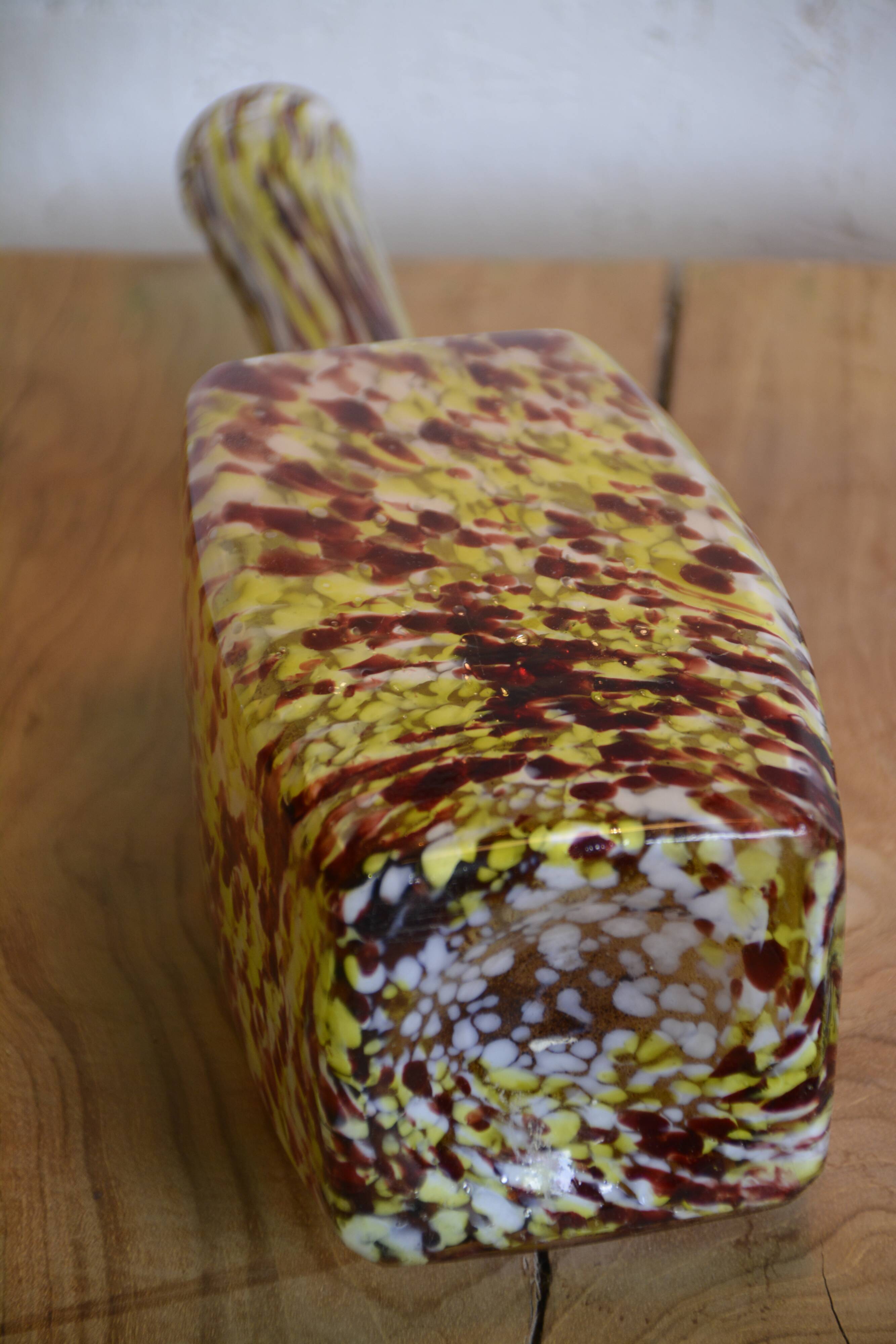 Yellow and white speckled decanter