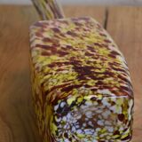 Yellow and white speckled decanter