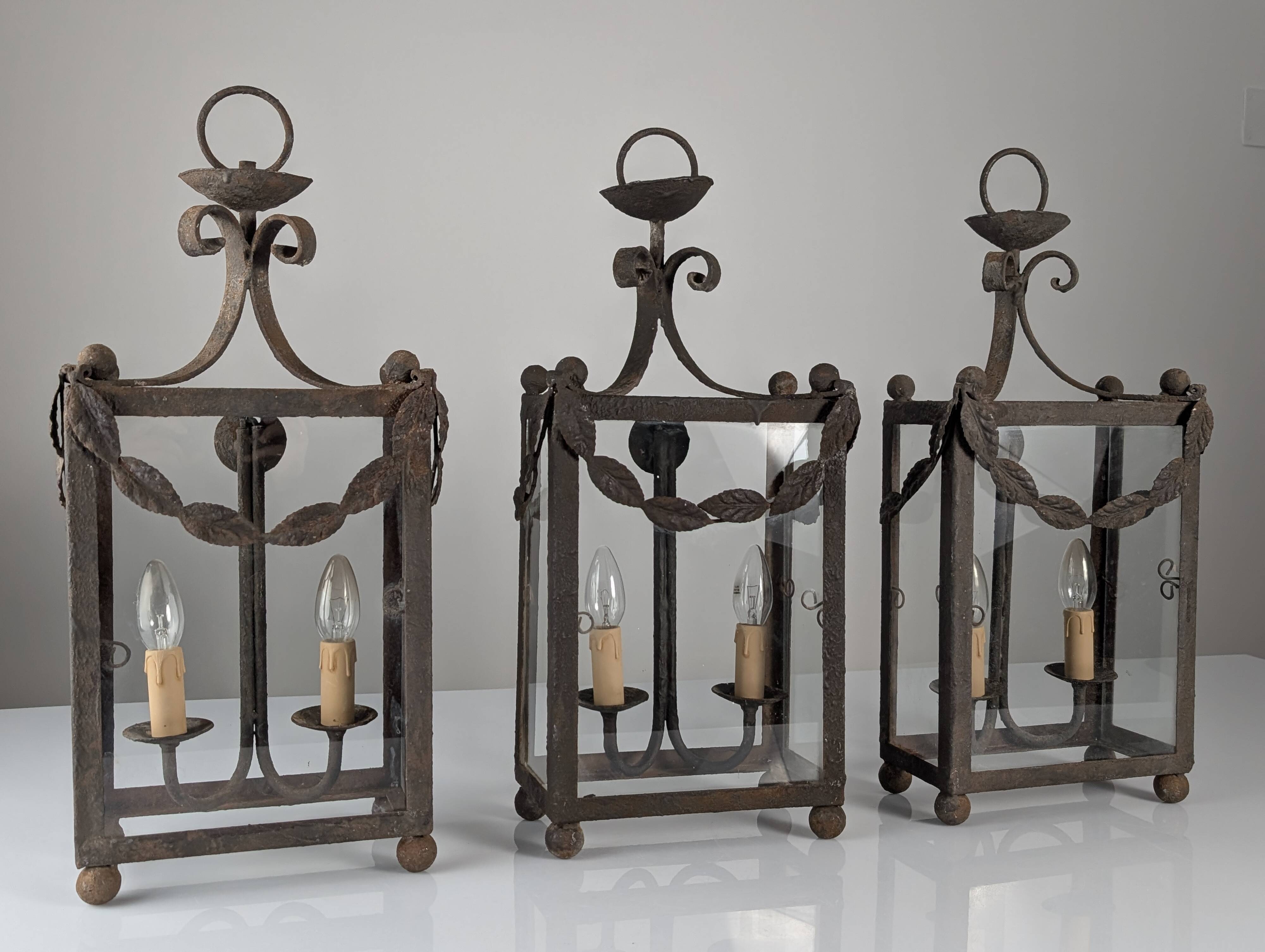 Wrought iron lantern with glass panels, leaf motifs