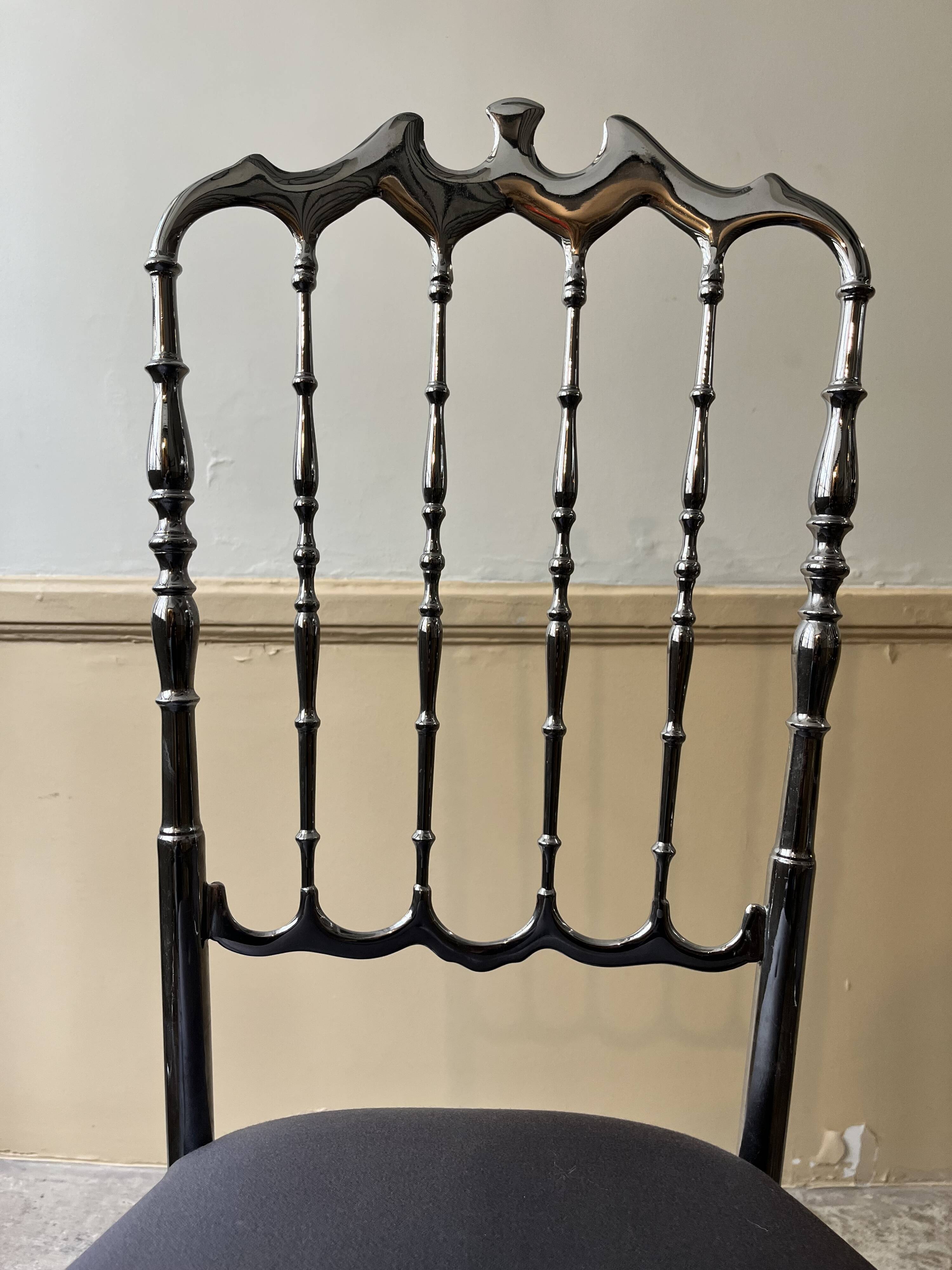 Pair of Chiavari chairs in polished mirror aluminium.