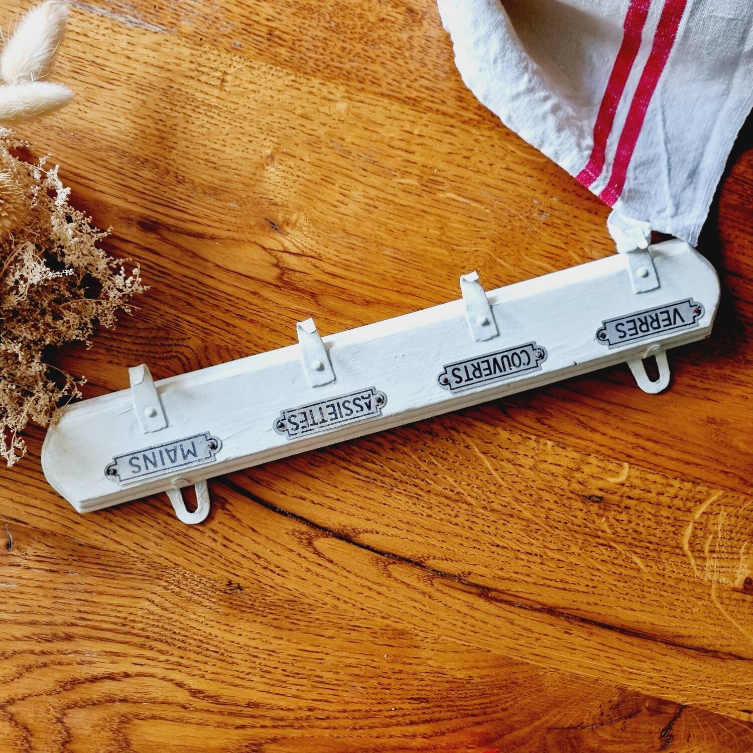 Old coat hook tea towel holder