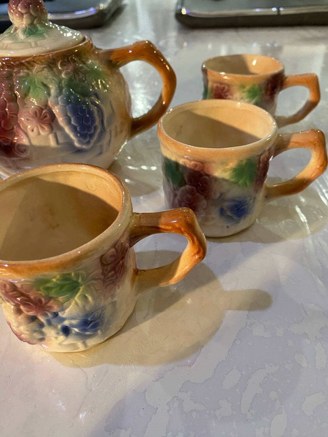 Vintage earthenware teapot and cup set