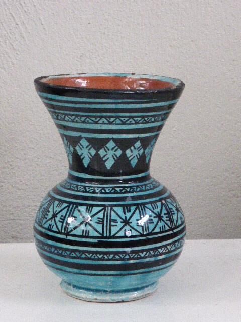 Nice oriental vase, black geometric patterns on blue background, vintage