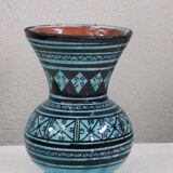 Nice oriental vase, black geometric patterns on blue background, vintage