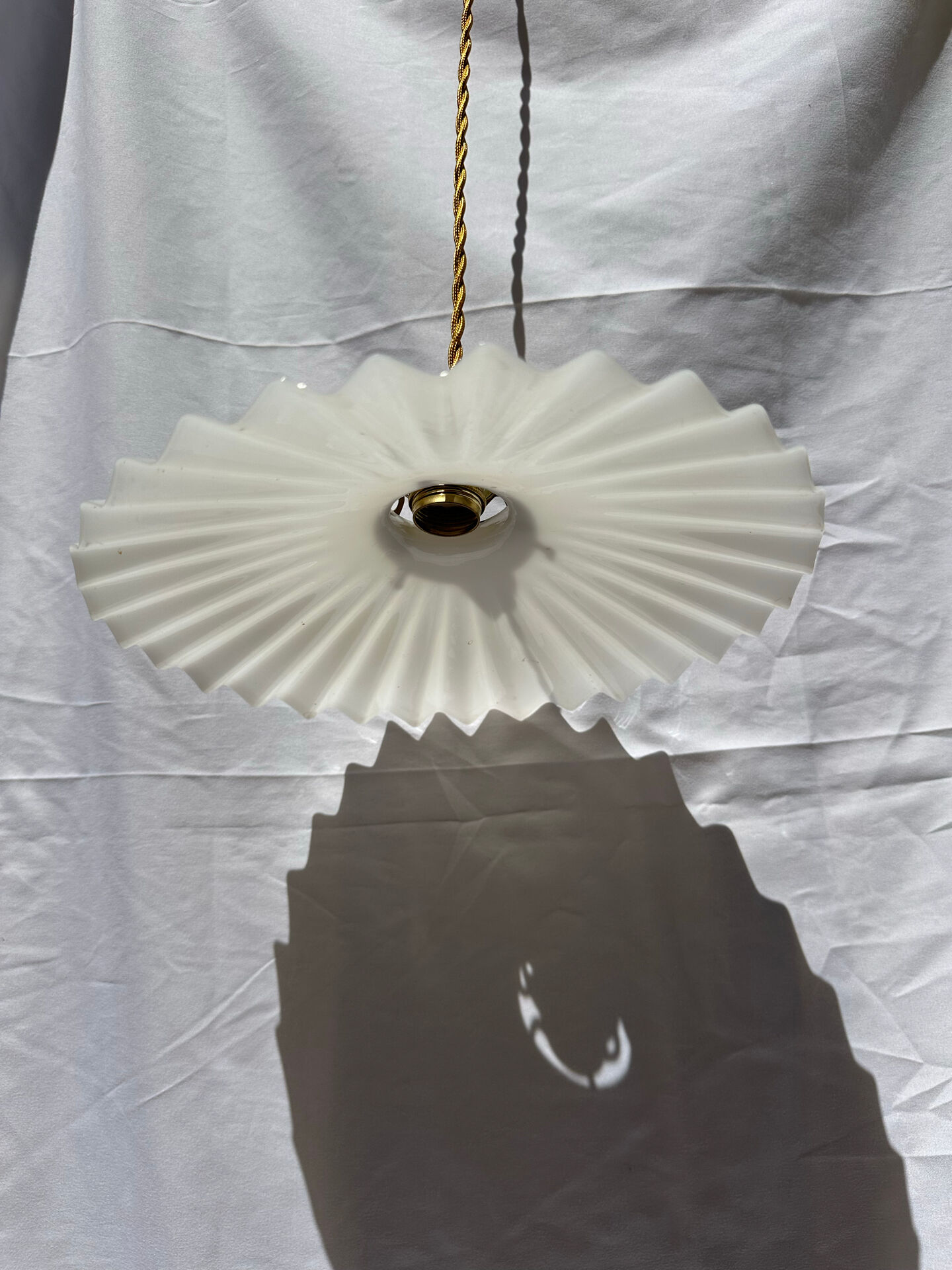 Vintage suspension opaline pleated lampshade with golden threads and claw socket.