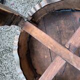 Old wooden saddle pedestal table with claw feet