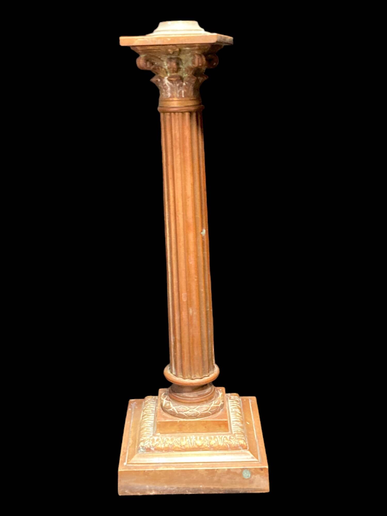 Bronze candle holder with floral motifs.