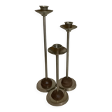 Trio of metal and wood candlesticks