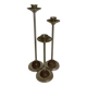 Trio of metal and wood candlesticks