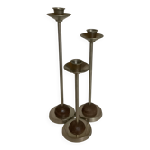 Trio of metal and wood candlesticks