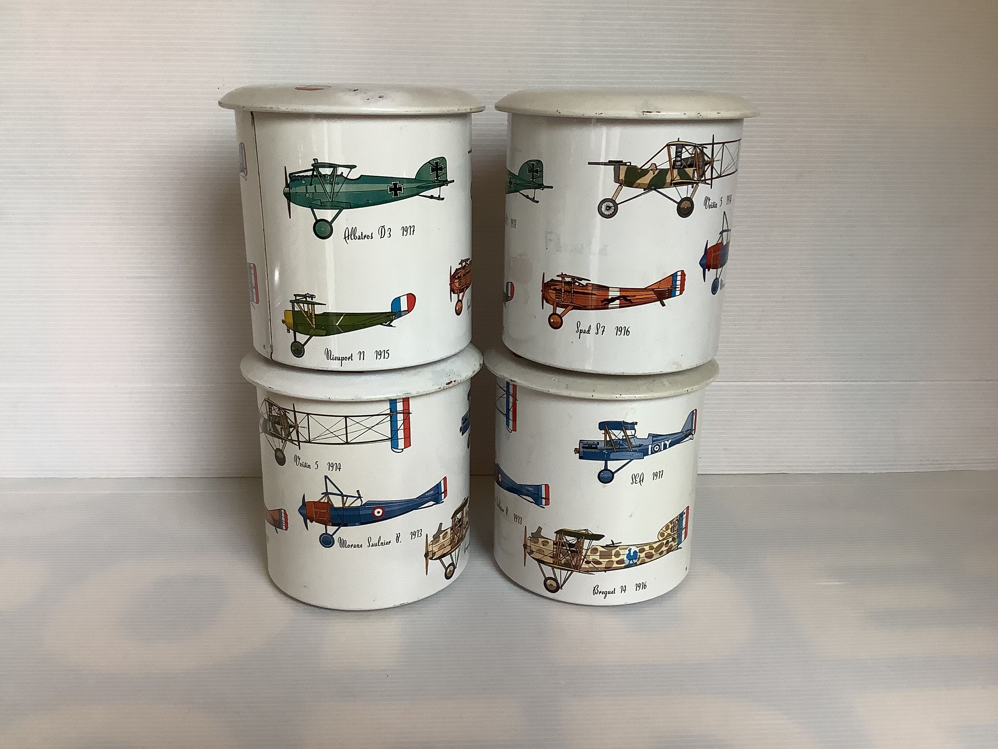 4 old metal boxes lithographed aircraft pattern