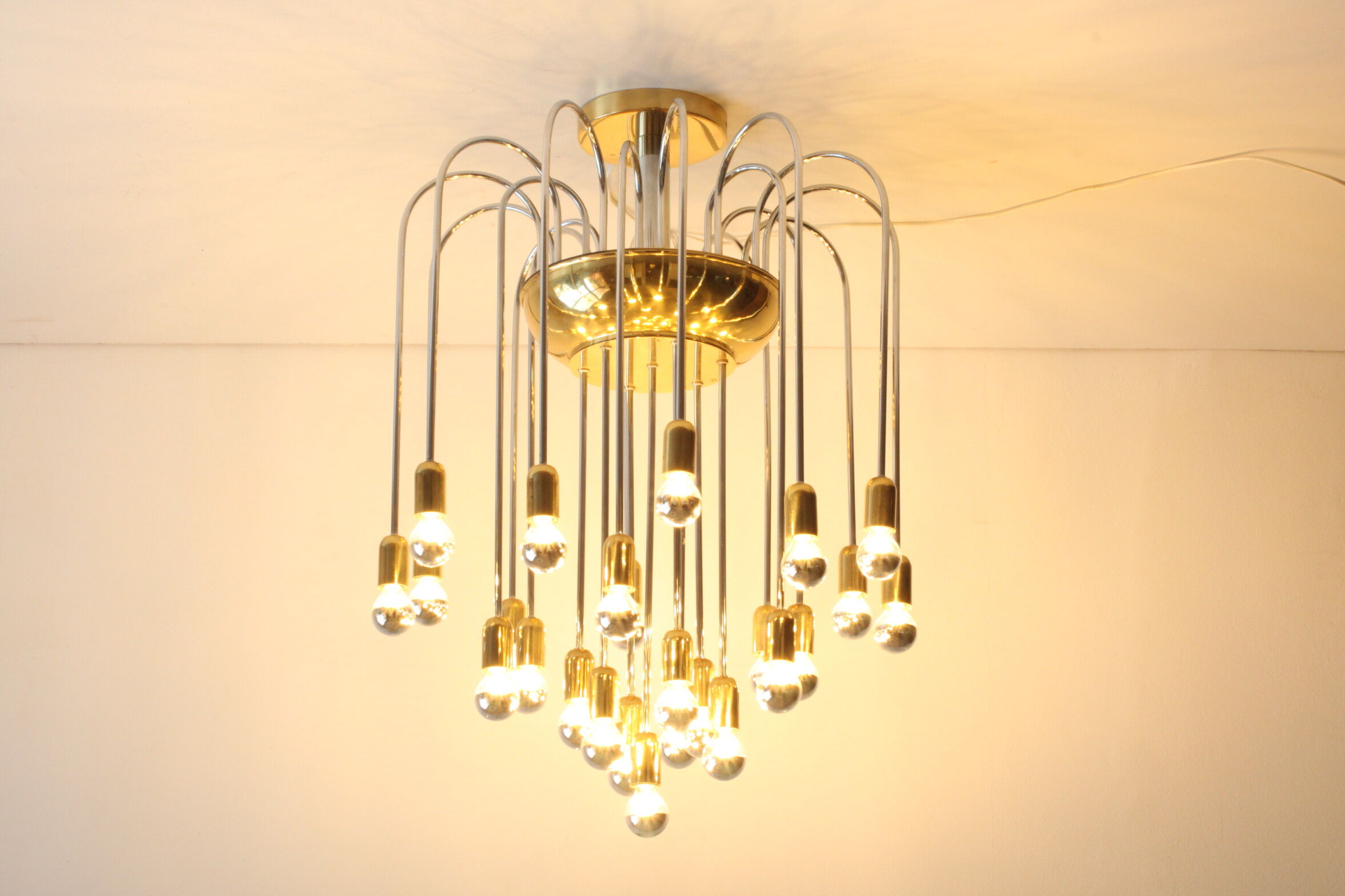 Tubular chrome and brass waterfall chandelier, Italy 1970s.