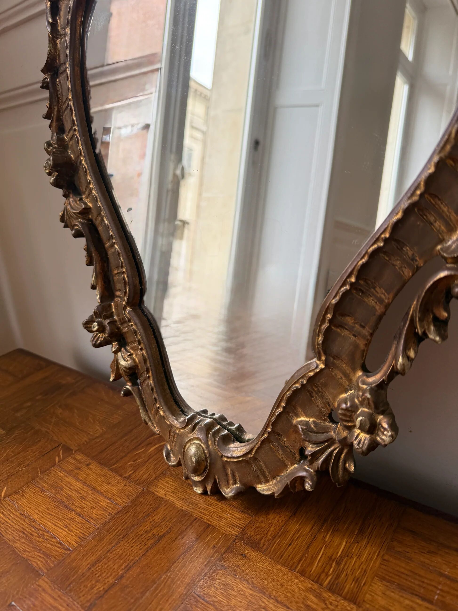 Golden rococo wall mirror