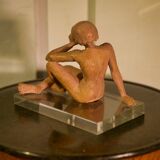 Terracotta sculpture of a seated woman by Norbert Treca contemporary art.