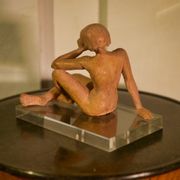 Terracotta sculpture of a seated woman by Norbert Treca contemporary art.