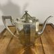 Art Deco silver-plated teapot with faceted decoration.