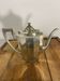 Art Deco silver-plated teapot with faceted decoration.