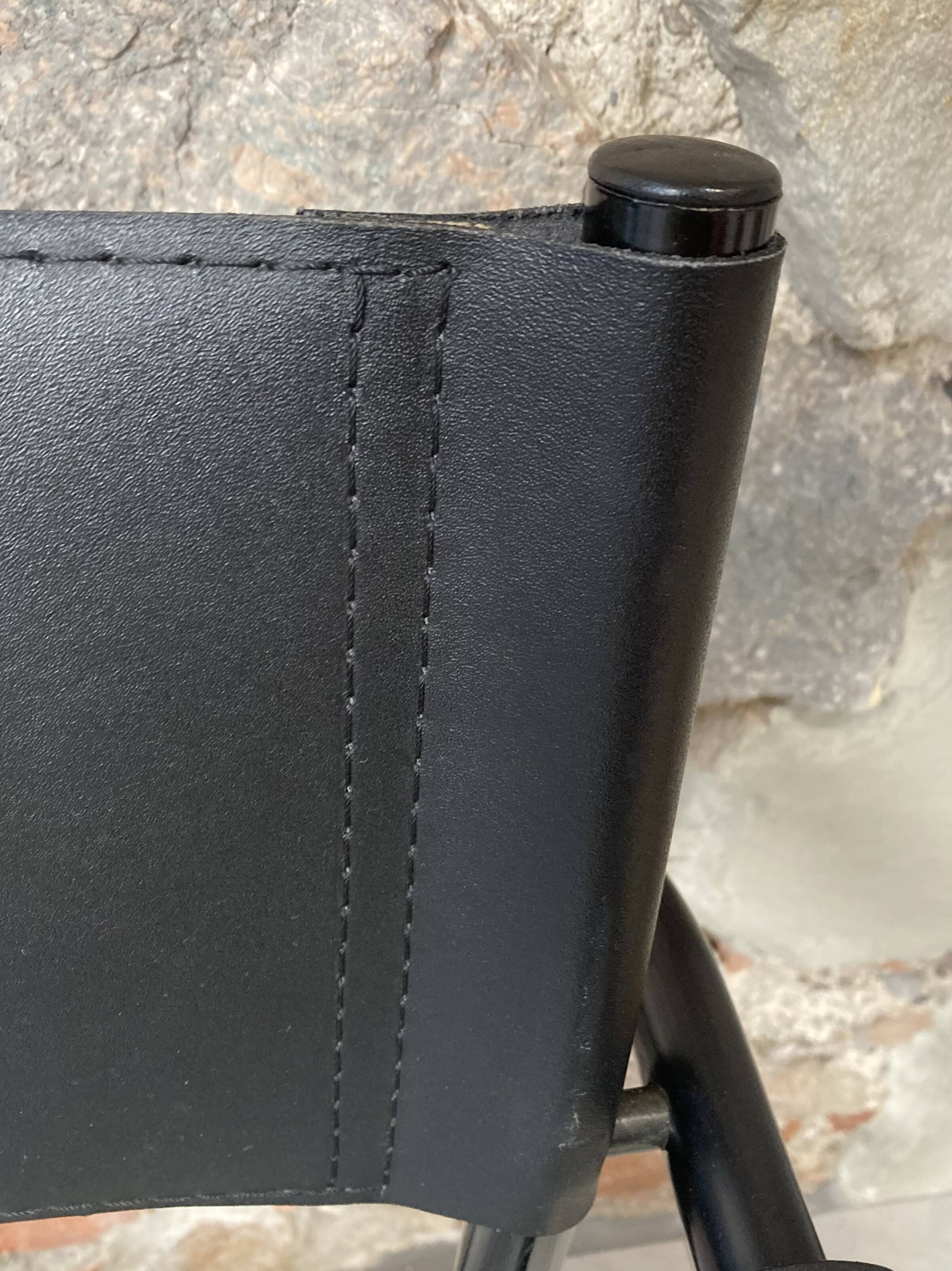 Armchair in black lacquered metal