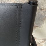 Armchair in black lacquered metal