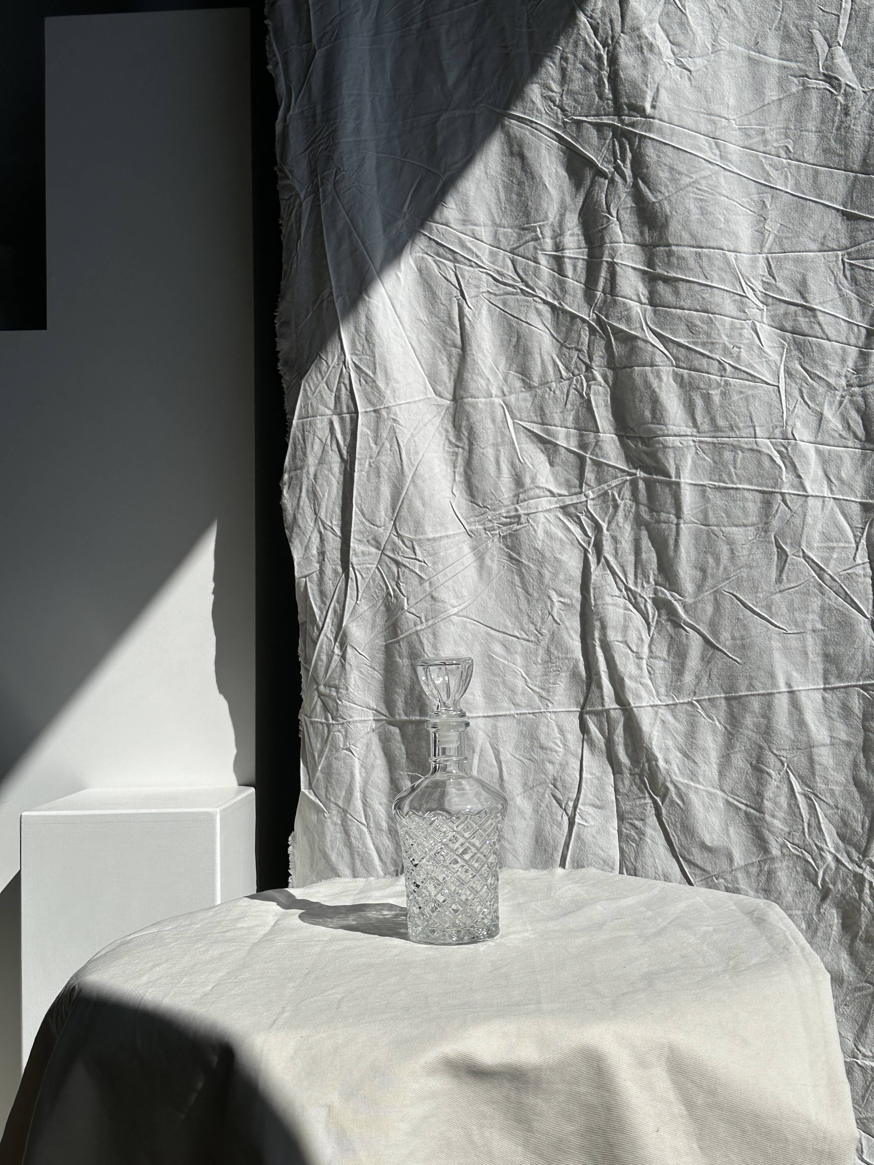 Small cylindrical glass whiskey decanter H:23