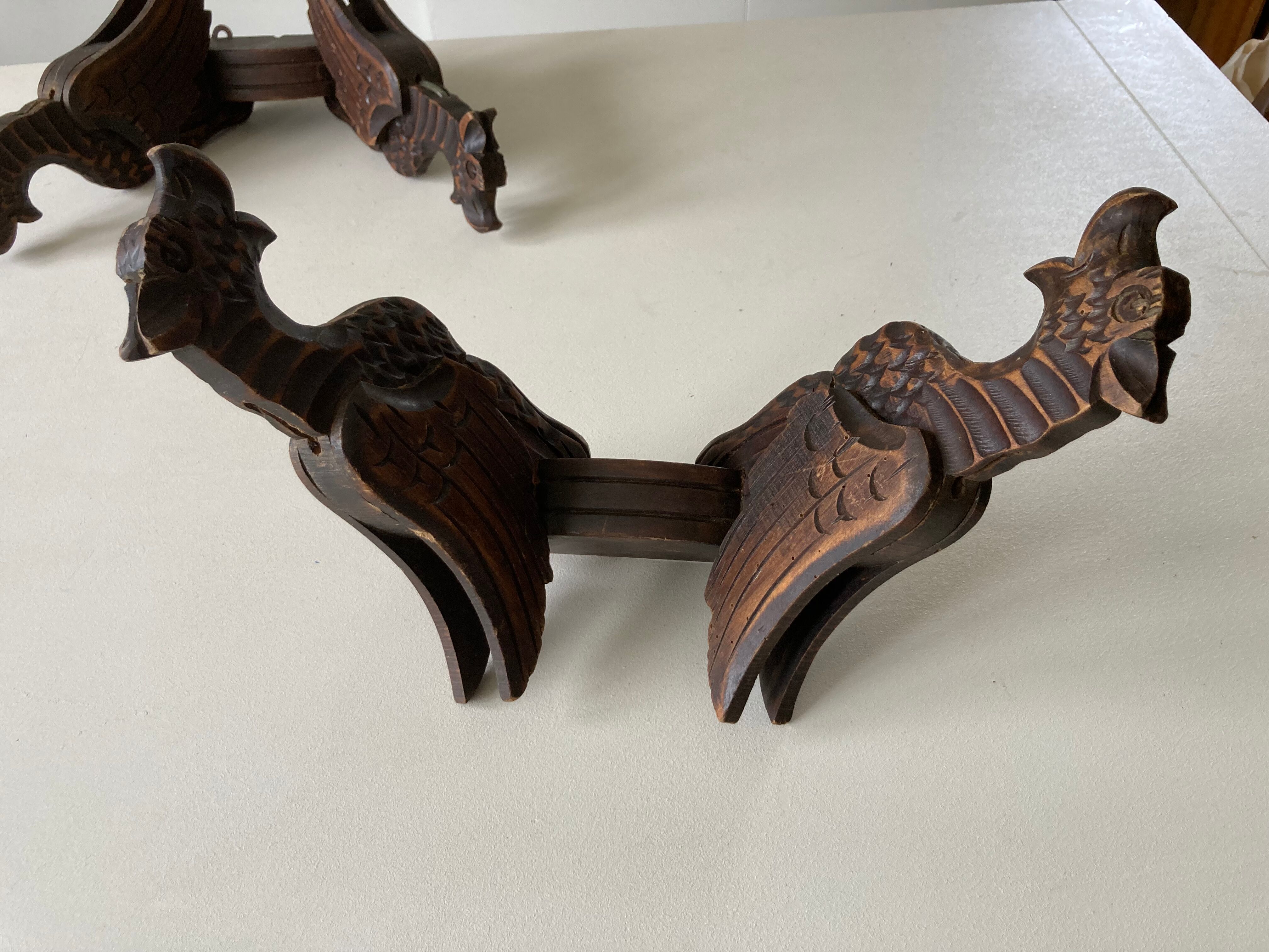Pair of winged dragon sconces in carved wood