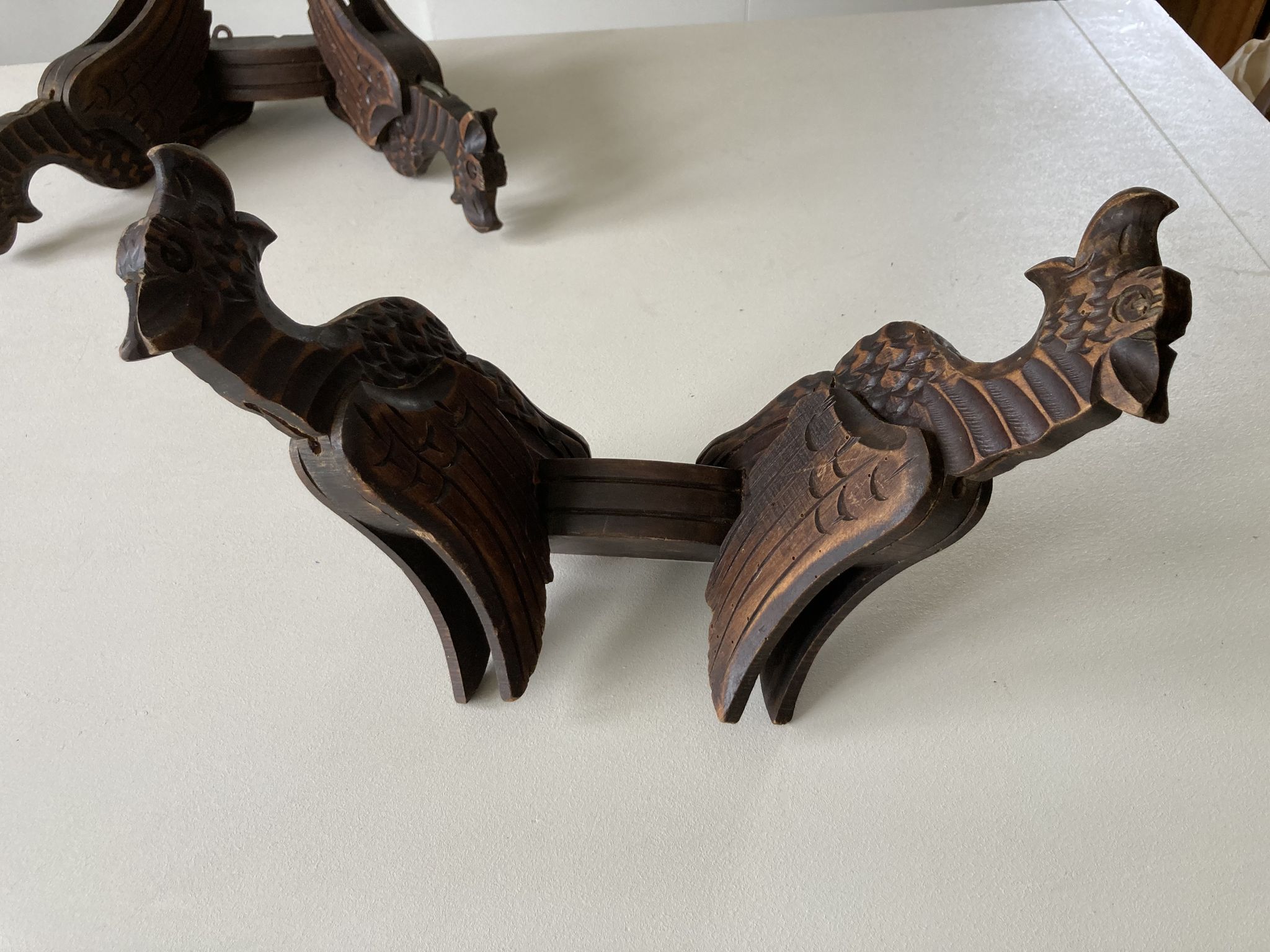 Pair of winged dragon sconces in carved wood