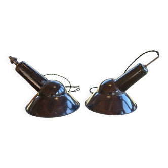 Pair of black enamelled sheet metal pendant lights from the 1950s.