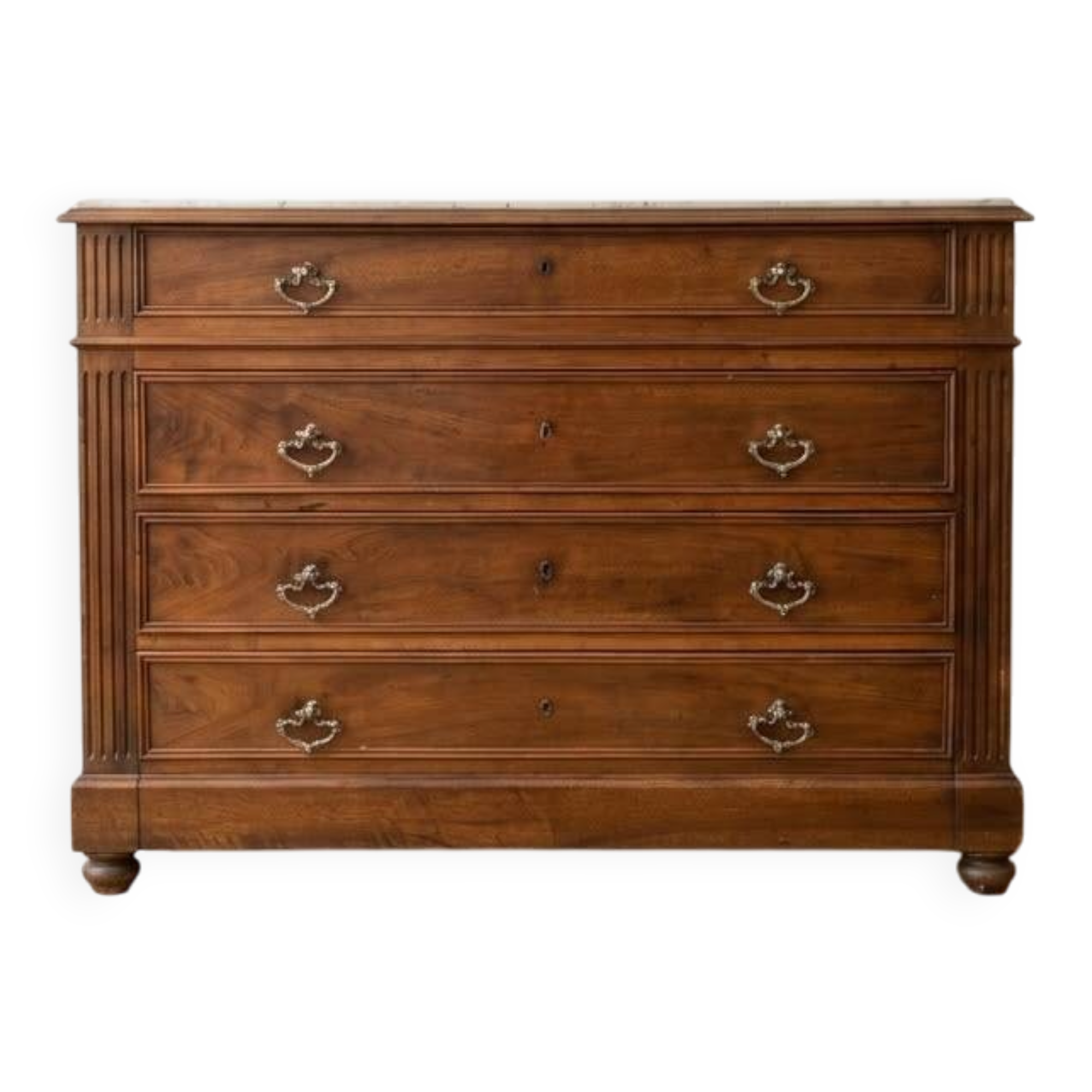 Antique wooden chest of drawers with a marble top.