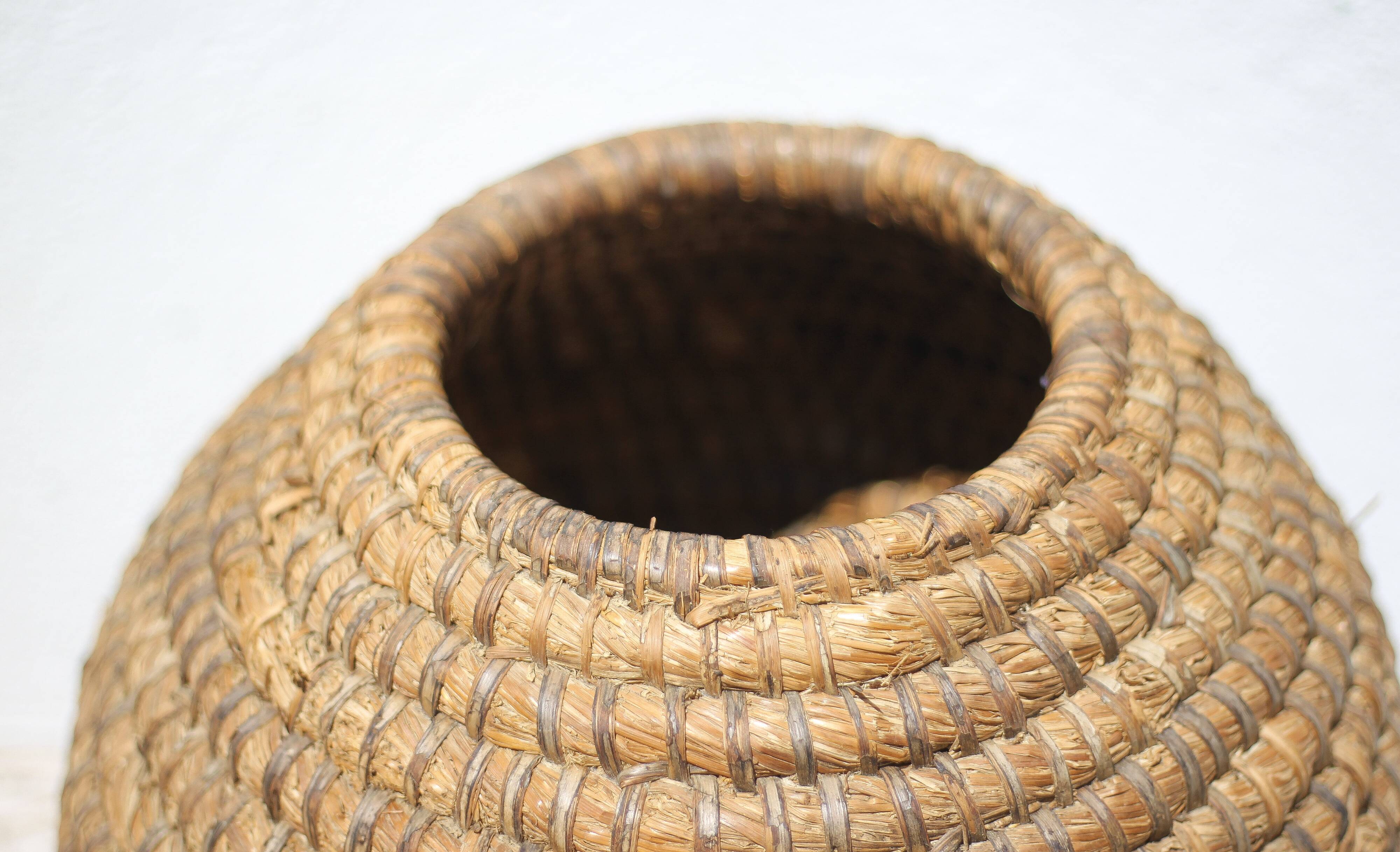 Old basket, burgundy straw and bramble, woven basket, interior decoration