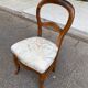 Antique flying chair in Restoration / Louis-Philippe style made of solid wood.