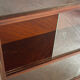 Vintage 1960s wooden library with sliding doors.