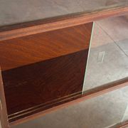 Vintage 1960s wooden library with sliding doors.
