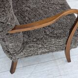1960s, reupholstered Danish armchair, with stool, genuine sheepskin.