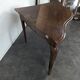 Louis XV corner table in walnut with curved legs.
