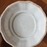 Important white earthenware pot cache with leafy decoration