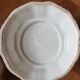 Important white earthenware pot cache with leafy decoration
