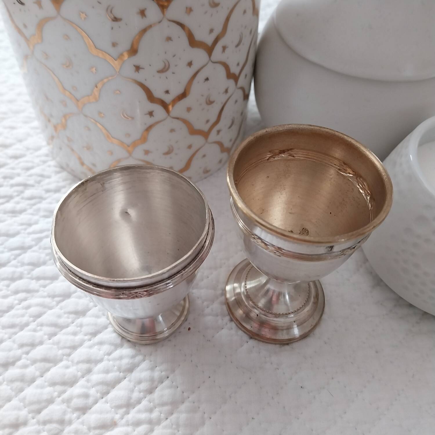 Antique egg cups on silver-plated metal stand
