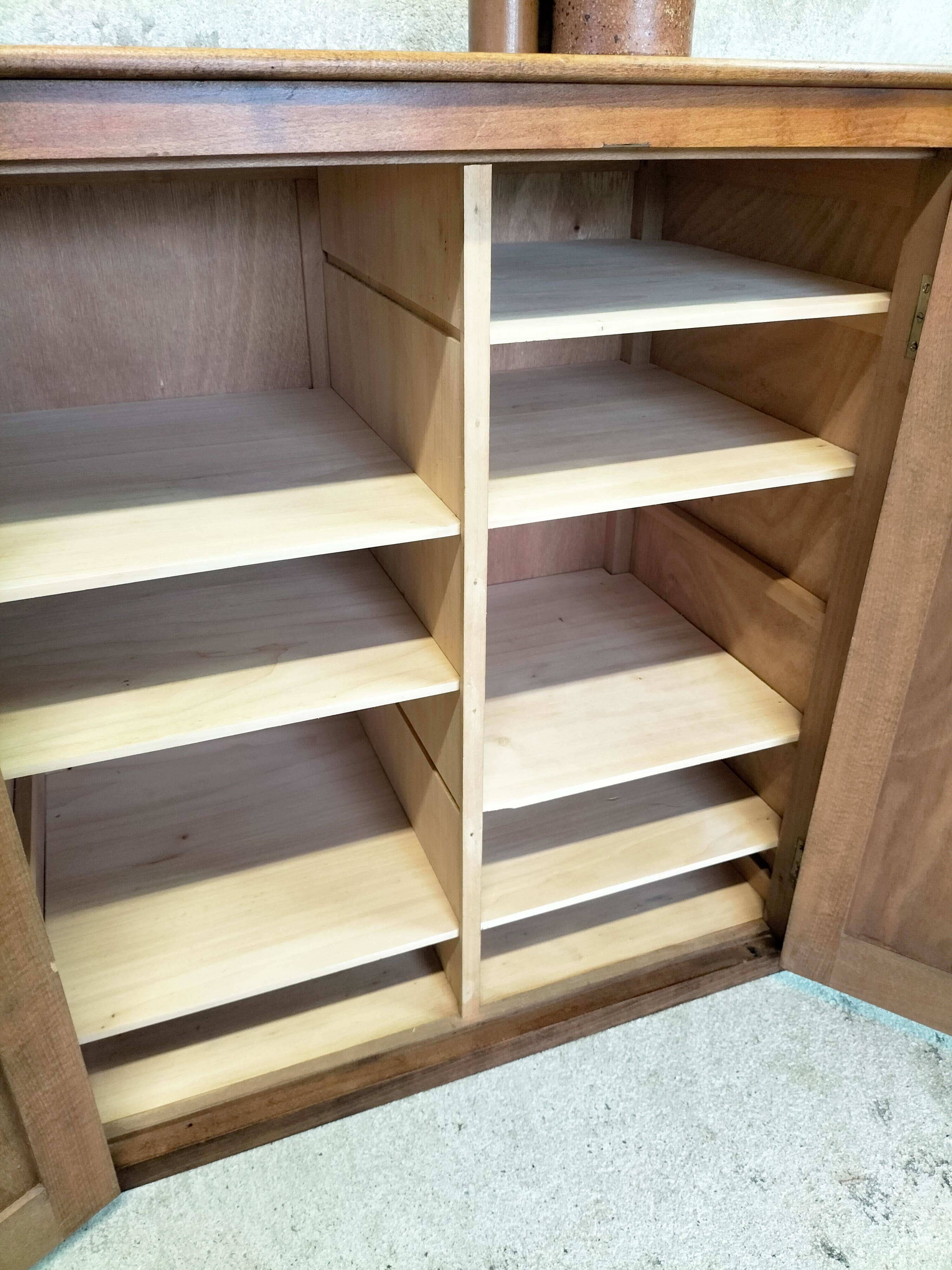 Small wooden sideboard with two doors.