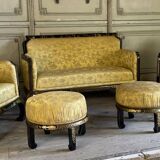A set of two armchairs, a sofa and two poufs in lacquered wood with gilded chinoiserie decoration.