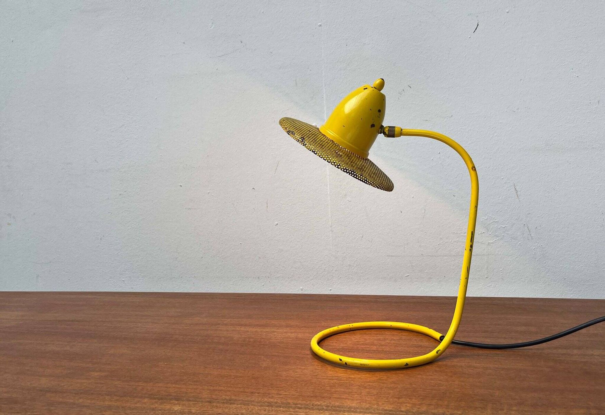 Perforated metal table lamp in Mid-Century Modern style, in the style of Mathieu Matégot, 1960s.