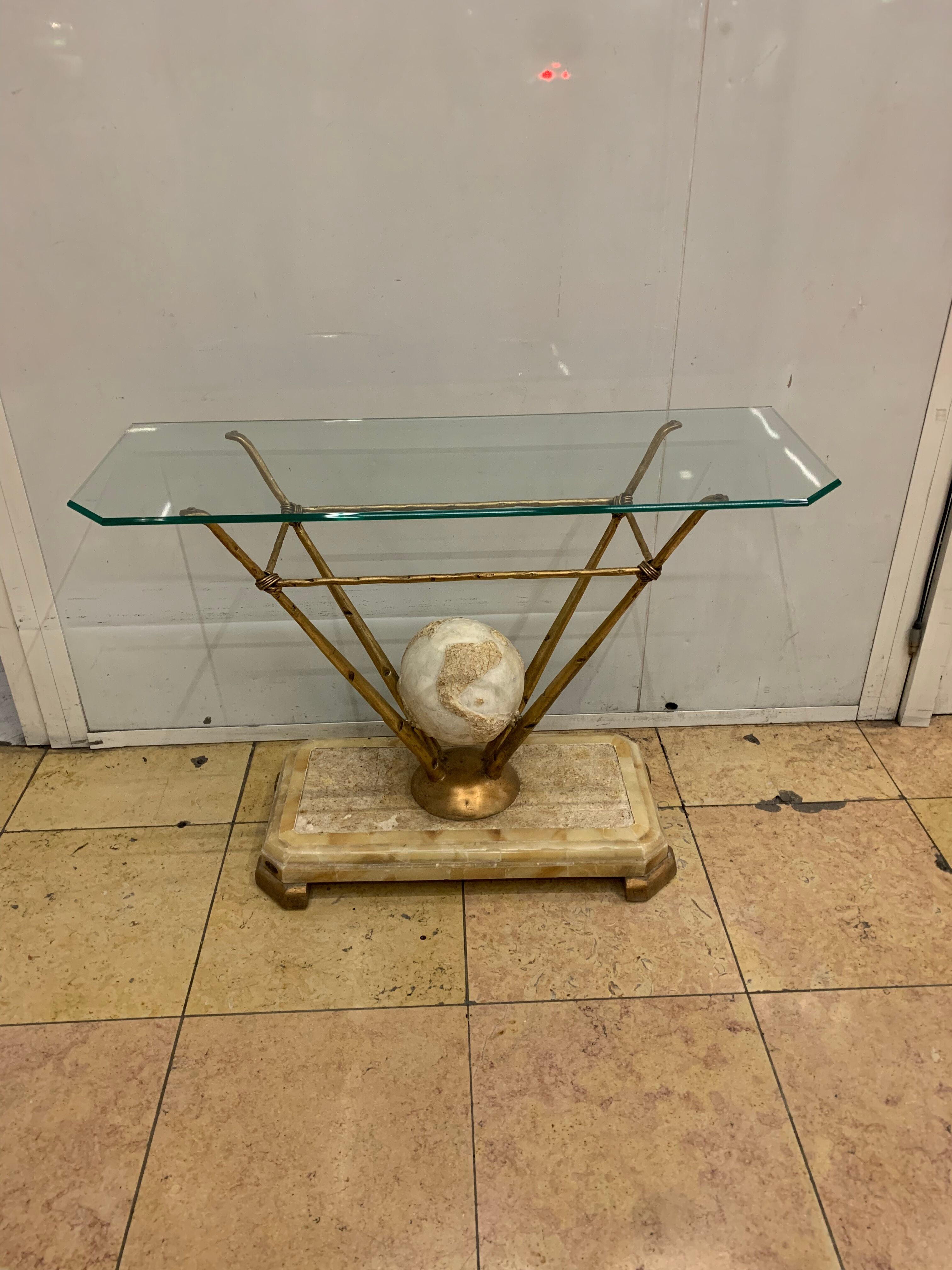 Travertine console from Fournier Paris over glass