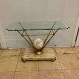 Travertine console from Fournier Paris over glass