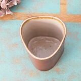 Vase with triangular section in sandstone signed